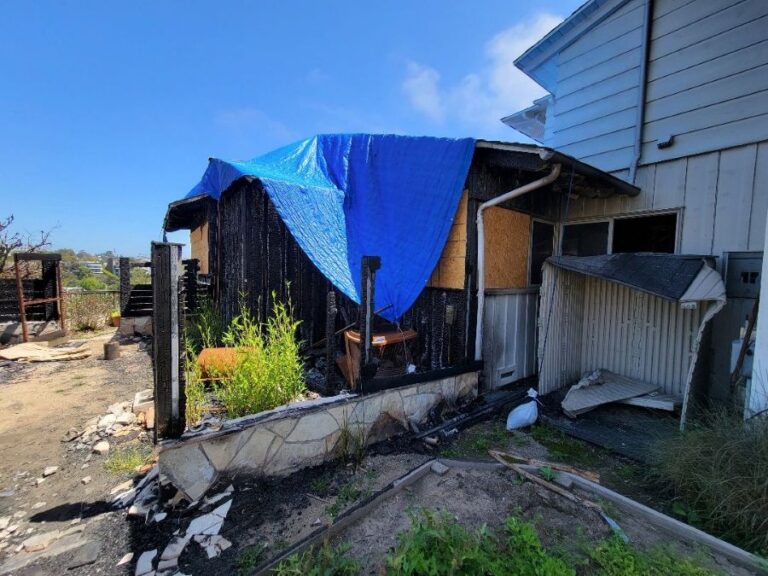 Picture of a home with a section that burned during a WUI fire.