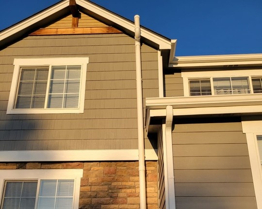 Picture of the outside of a home in Colorado with a radon mitigation system installed.